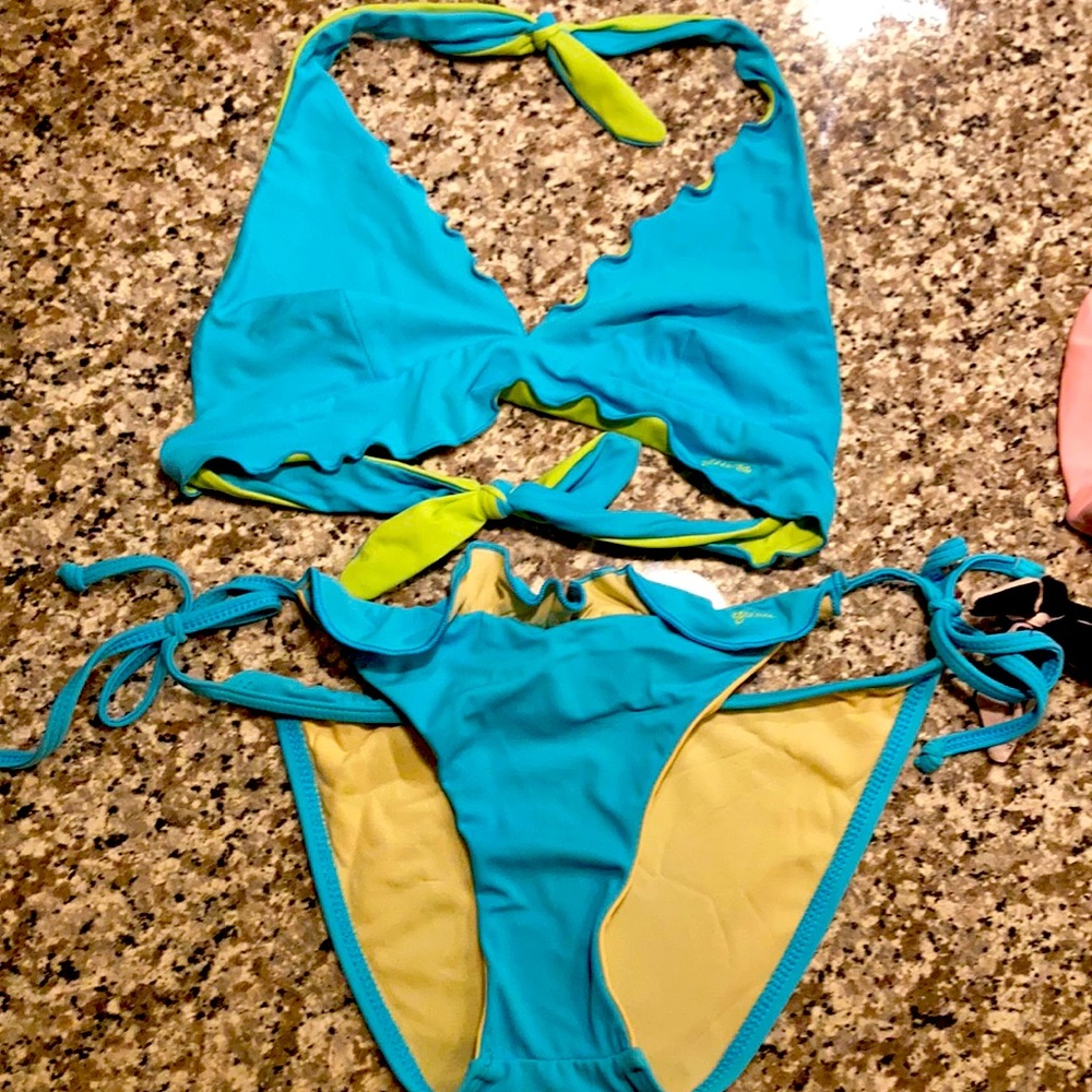 TWO M Guess bathing suits. Reversible tops. Some signs of wear on black bottom